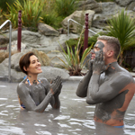 Couple bathing in mud in Hells Gate, Rotorua